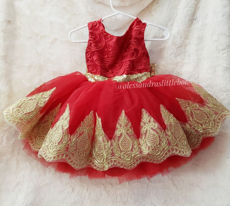 Princess Ella Couture Dress in red and light gold Perfect for any special occasion features a beautiful lace top, sequin sash, oversized back bow and a beautiful light gold lace trim at knee lenght. Handmade to order in the U.S.A Can be customized in different colors to fit your theme or color scheme Red Gown With Lace Bodice For Party, Gold Holiday Celebration Dress, Gold Holiday Gown, Gold Lace Dress For Party, Red Fitted Gown For Dress-up, Festive Sleeveless Lace Dress, Gold Dress For Christmas Wedding, Gold Wedding Gown For Holiday Season, Gold Wedding Gown For Holiday