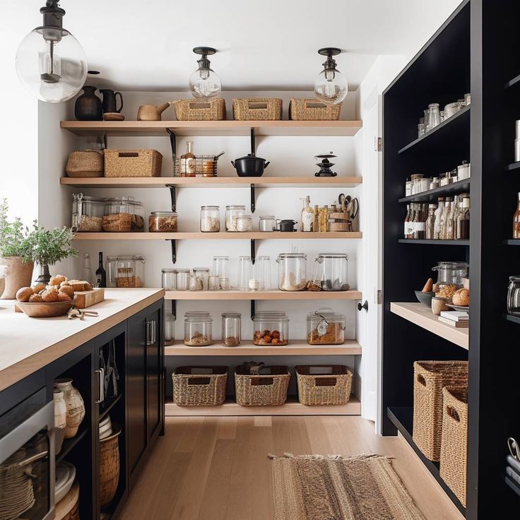 a kitchen with lots of shelves and baskets on the counter top in front of it