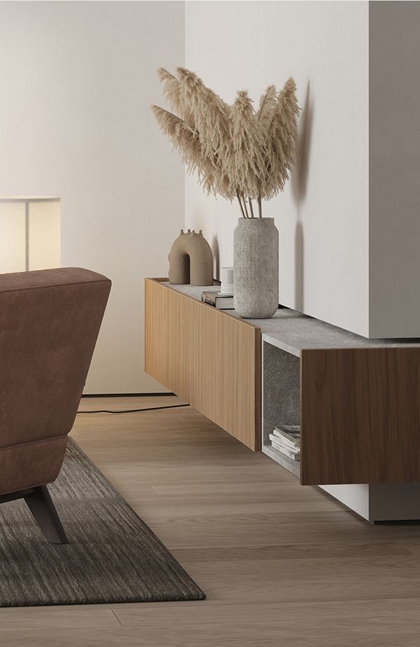 a brown chair sitting next to a wooden table on top of a hard wood floor