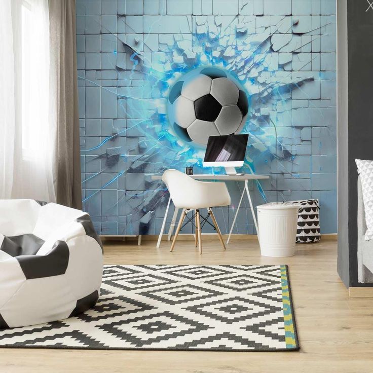 a room with a soccer ball painted on the wall and a rug in front of it