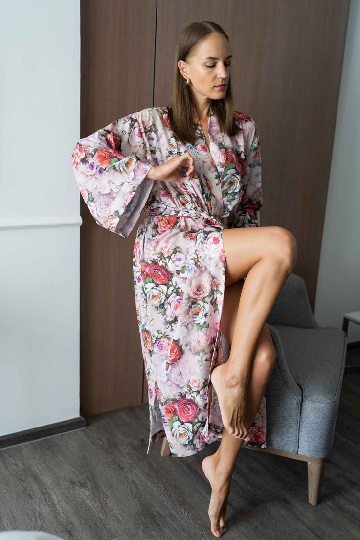 The perfect gift for anyone who loves the finer moments in life, this soft and sexy kimono robe is crafted by hand with strong attention to detail. With a gorgeous print and exclusive stitches, it's perfect for an extended variety of use. Crafted by hand with strong attention to detail which boasts the finest rayon fabric. Rayon is a versatile fabric made from purified cellulose fibers, known to take on the properties of silk.Lightweight and delicate, rayon feels like a smooth breeze on your ski Pink Floral Print Robe For Home, Pink Floral Print Home Robe, Feminine Floral Print Robe For Loungewear, Pink Spring Robe For Relaxation, Pink Robe For Spring Relaxation, Spring Sleep Robe With Kimono Sleeves, Pink Kimono For Home Use In Spring, Pink Kimono For Home During Spring, Pink Spring Kimono For Home