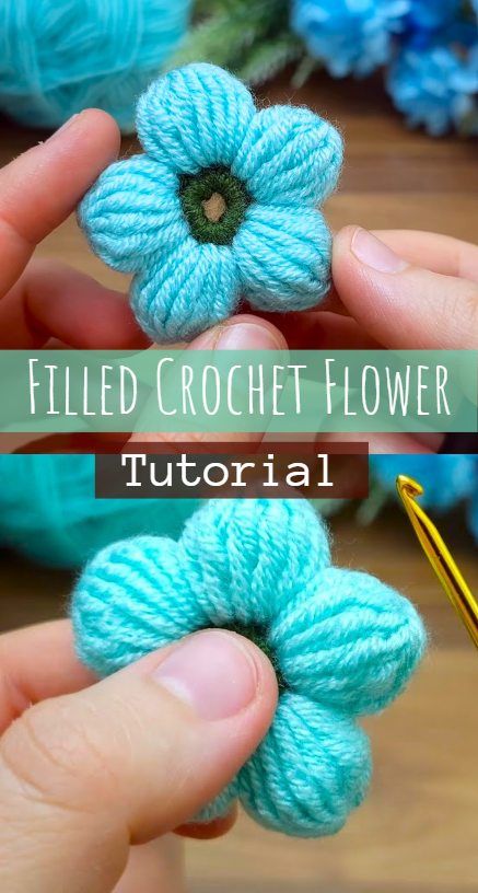 crochet flowers are being held by someone's hands