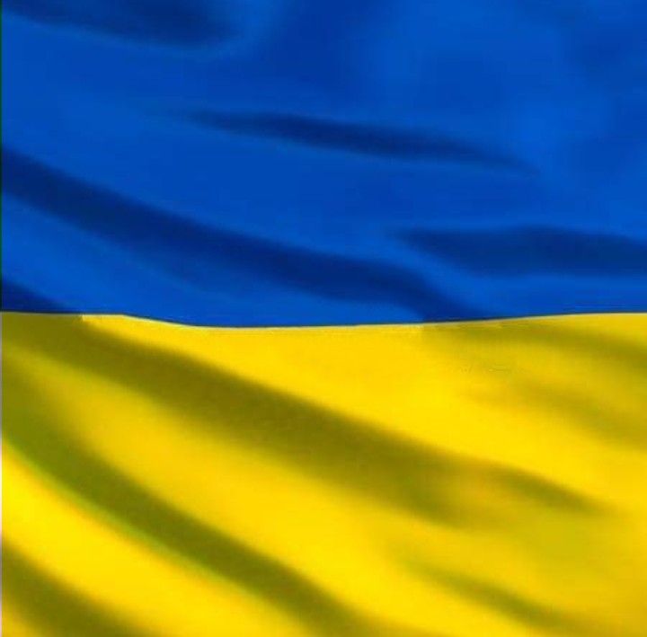 the flag of ukraine is waving in the wind with blue and yellow stripes on it