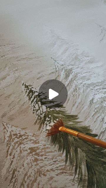 an arrow is stuck in the sand on top of a mountain