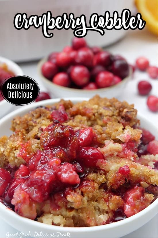 cranberry cobbler in a white bowl with text overlay that reads, cranberry cobbler absolutely delicious