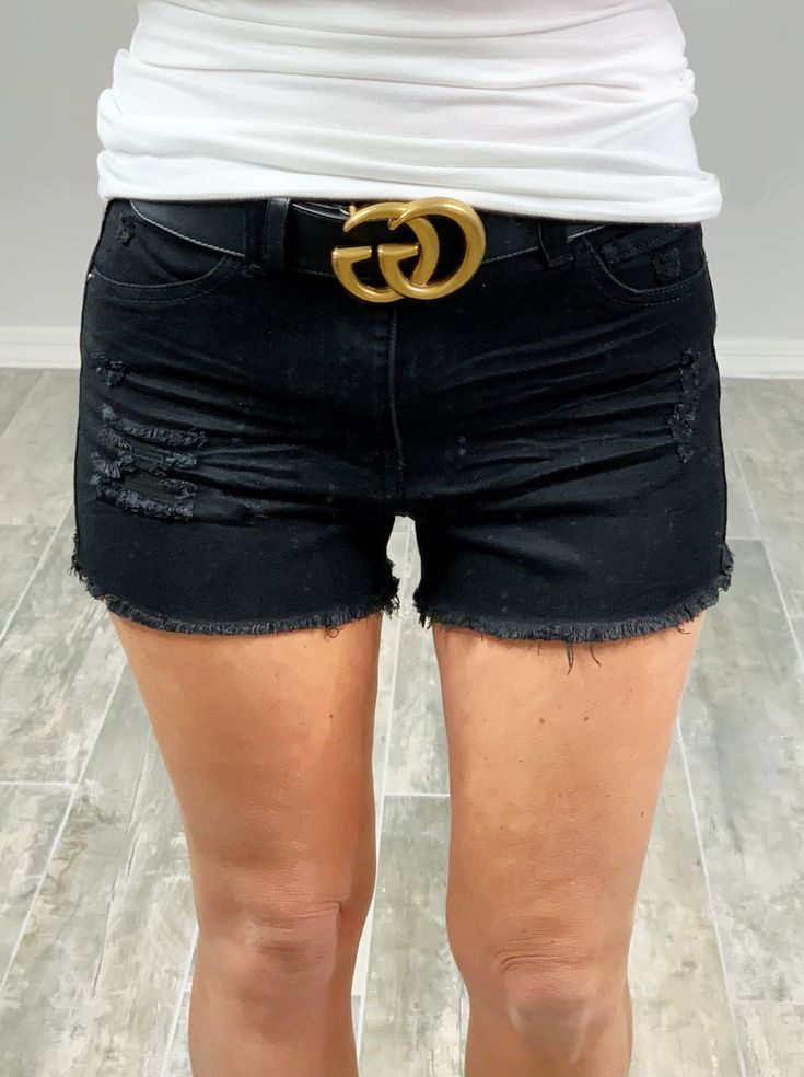 Women's Black Distressed Denim Shorts Under The Radar Shorts - Black Get ready to be the ultimate rockstar in these high-waisted shorts! With a destructed style and frayed hem, these shorts are perfect for any wild adventure. Complete with a classic 5-pocket design, zipper fly, and button closure. Don't pass up on these essential shorts! (Seriously.) Details Available in sizes S - L Several Color Options 95% Cotton, 4% Polyester, 1% Spandex Distressed Shorts With Pockets 95% Cotton, 4% Polyester Chic Distressed Cutoff Shorts, Chic Distressed Jean Shorts, Trendy Black Jean Shorts With Frayed Hem, Essential Shorts, Wild Adventures, Distressed Shorts, Distressed Denim Shorts, Shorts Black, Shorts With Pockets