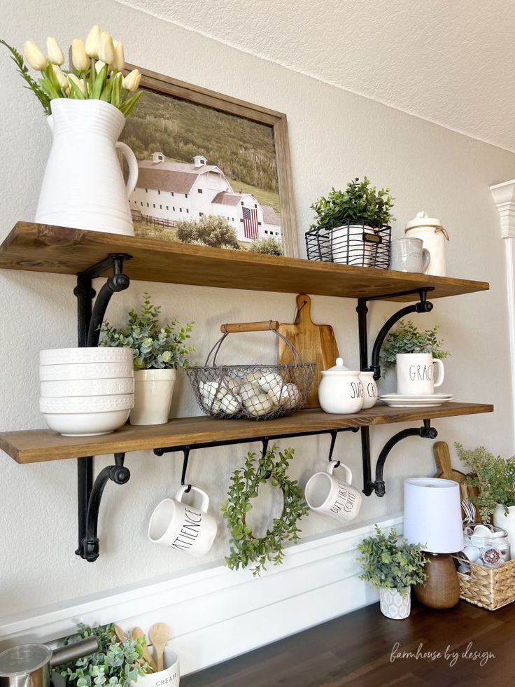 some shelves with coffee cups and flowers on them