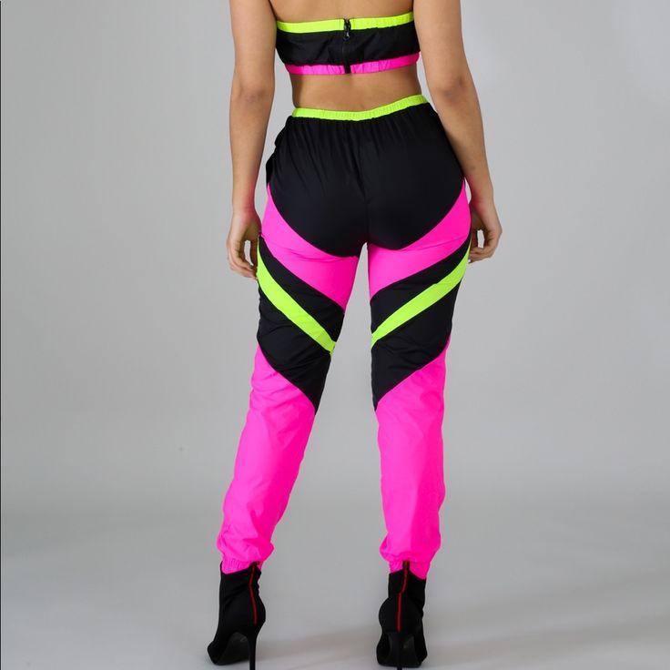 Two Piece Neon Jogging Set. Pants And Top. Casual Pink Pants For Night Out, Fitted Pink High Waist Set, Sporty Pink Summer Pants, Pink Stretch Long Pants Set, Pink High Waist Stretchy Set, Pink Stretch Sets With Long Pants, Pink Workout Set For Spring, Pink Athleisure Pants For Summer, Pink Spring Workout Sets