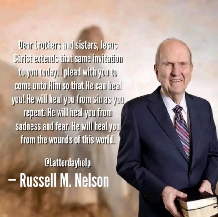 a man in a suit and tie holding a book