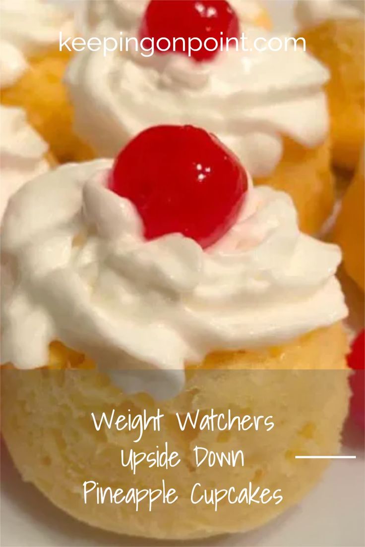 some cupcakes with white frosting and a cherry on top are shown in this image