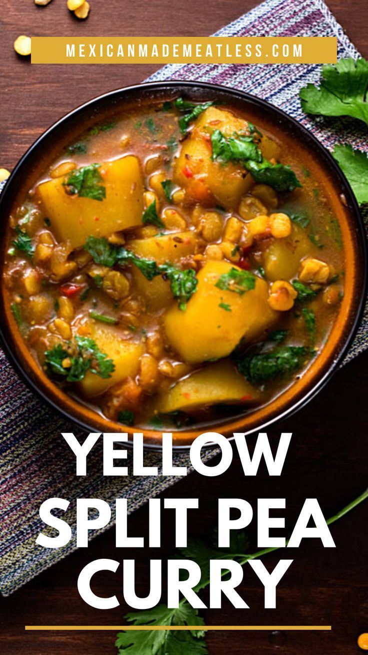 yellow split pea curry in a bowl on a wooden table with cilantro and parsley