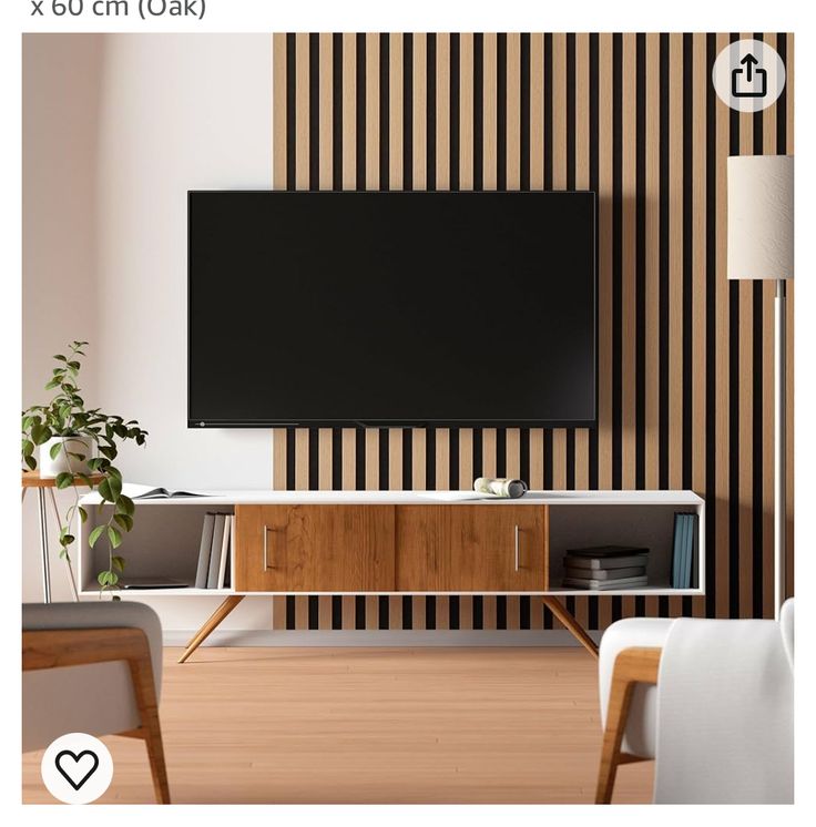 a flat screen tv mounted to the side of a wall