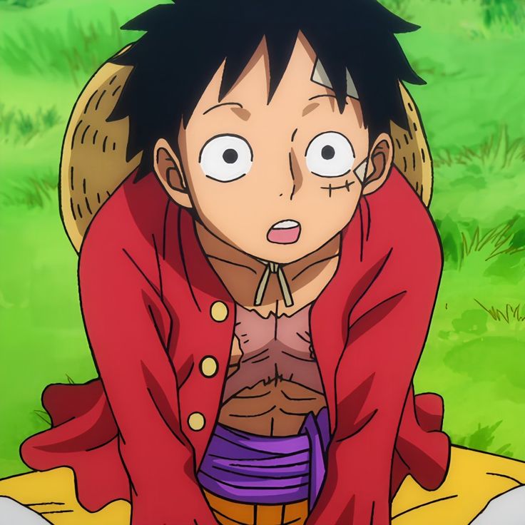 an anime character is sitting on the ground with his eyes wide open and tongue out