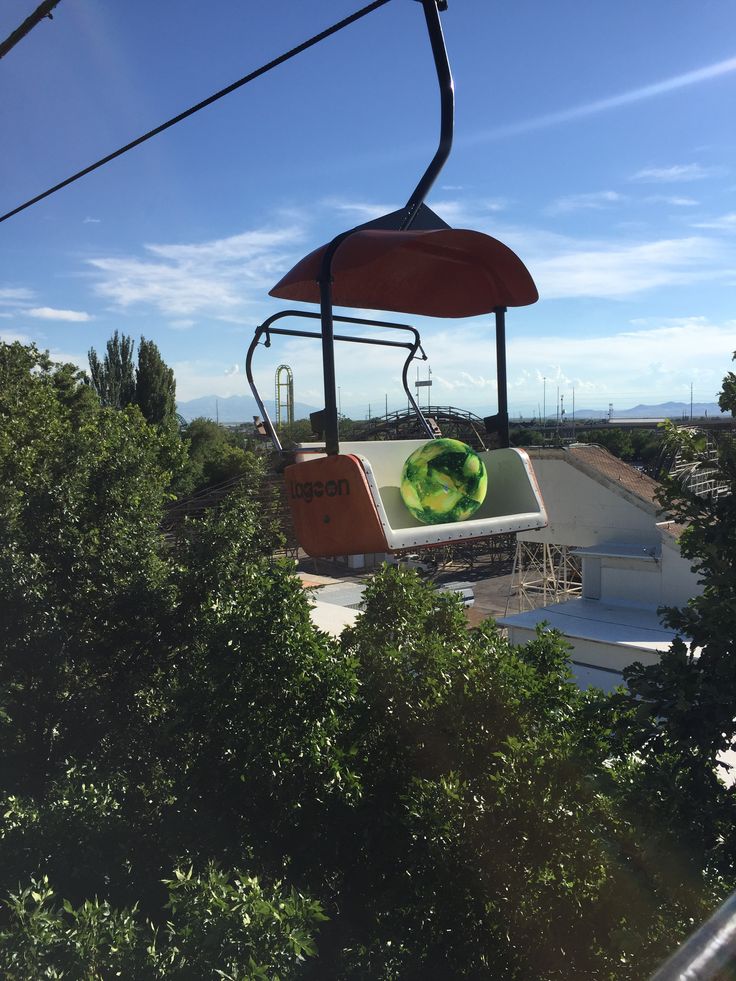 an overhead view of a gondola with trees in the foreground