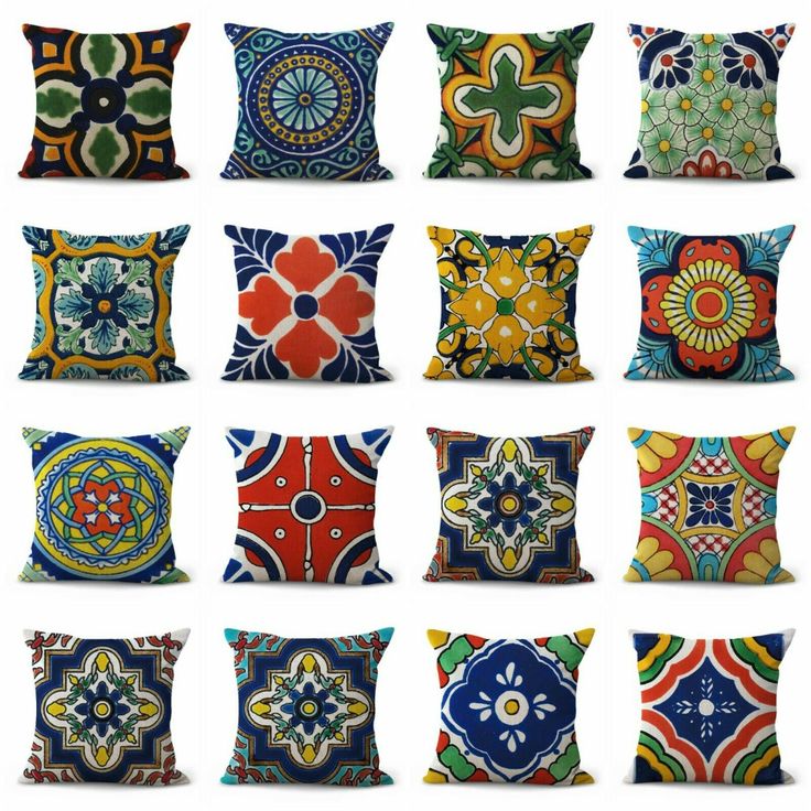 many colorful pillows with different designs on them