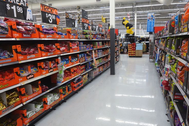 an aisle in a store filled with lots of items