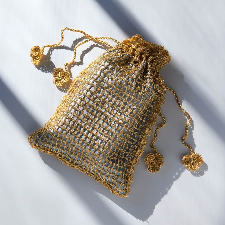 A pouch in gold, lined with a soft blue, that shimmers like a walk home (or elsewhere) in the early evening hours. Just large enough for a few small essentials (will fit a phone, the 21st century's most essential essential?). Handle gently and with care � each Evening Pouch is made by hand and will vary slightly. Gold Rectangular Phone Bag Gift, Gold Rectangular Phone Bag With Removable Pouch, Gold Shoulder Bag For Travel, Gold Travel Shoulder Bag, Portable Gold Shoulder Bag For Travel, Gold Pouch Shoulder Bag For Travel, Gold Party Pouch Gift Bag, Elegant Gold Phone Bag For Travel, Gold Pouch Phone Bag For Daily Use