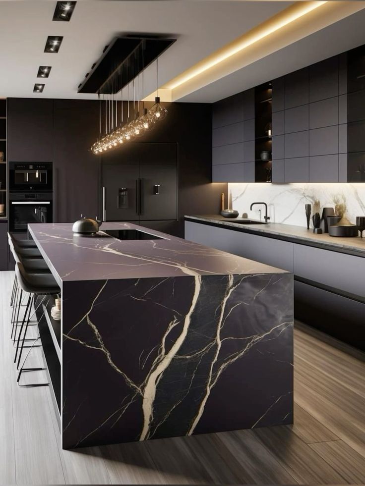 a modern kitchen with marble counter tops and black cabinets, along with bar stools