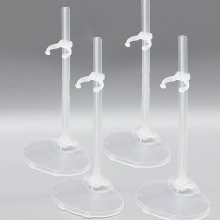 three clear glass candlesticks with white handles