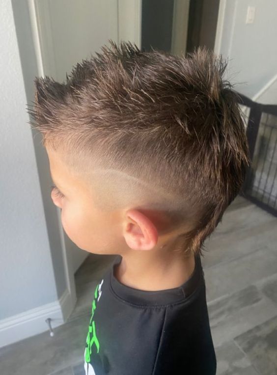 Top 18 Mohawk Haircuts For Your Kids To Try In 2024 Boy Fohawk Haircut, Baseball Mohawk Hair, Kids Mohawk Hairstyles, Boys Haircut Mohawk, Boys Haircut Mohawk Mullet, Mohawk Fade Boys, Mullet Hairstyle Boys Kids, Mohawks For Boys, Fauxhawk Fade Boys