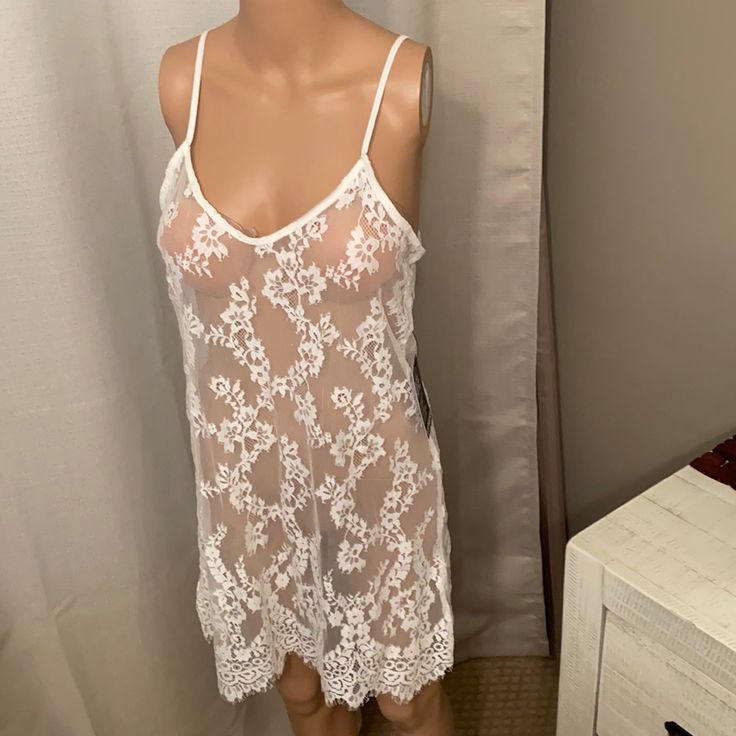 Shear Lace Slip Small Cream From Express New With Tags Feminine Camisole With Built-in Bra For Vacation, White Beach Camisole With Built-in Bra, Sleeveless Lace Sleepwear For Vacation, Delicate Lace Sleepwear For Beach, Summer V-neck Sleepwear With Delicate Lace, Delicate Lace V-neck Sleepwear For Summer, Feminine Cami Sleepwear For Vacation, Feminine Delicate Lace Sleepwear For Beach, Sleepwear With Built-in Bra For Vacation