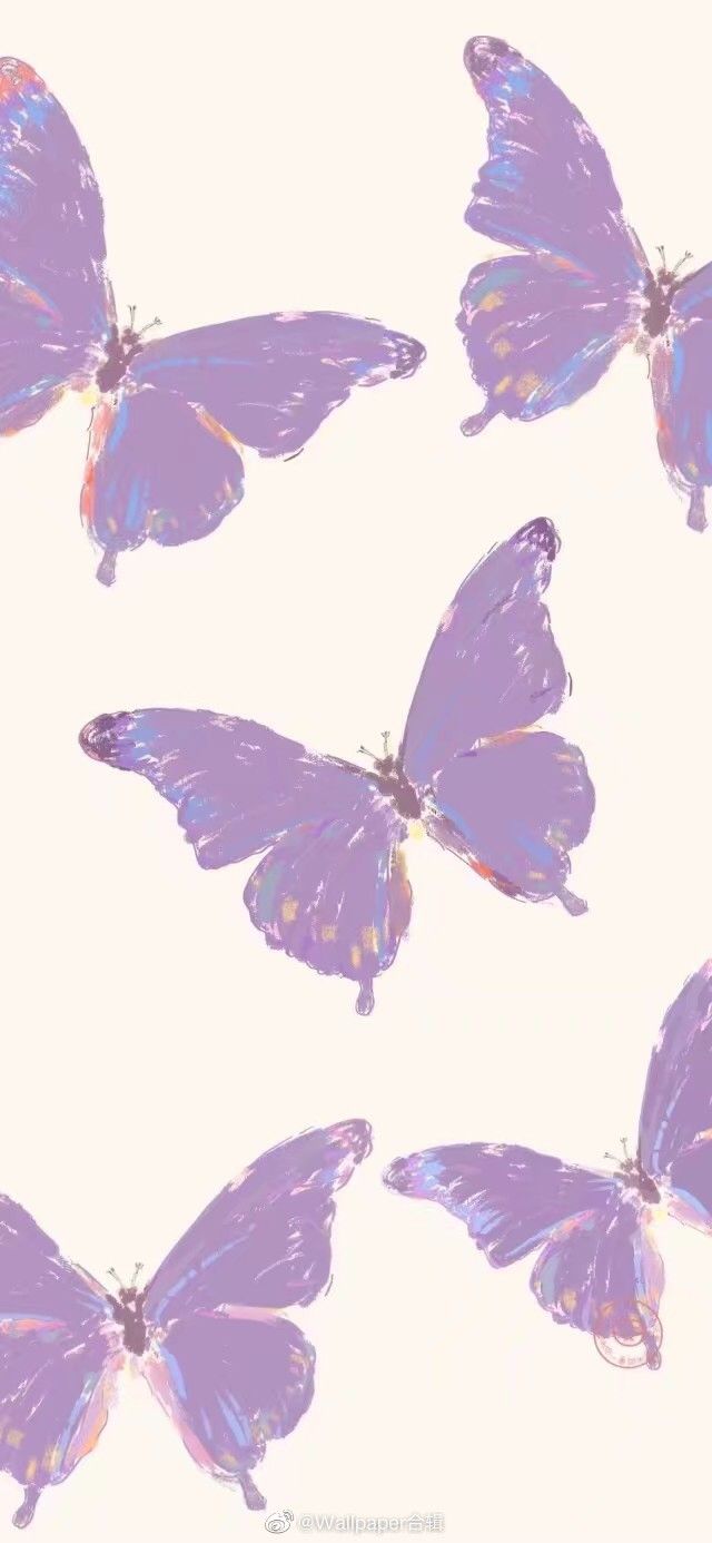 several purple butterflies flying in the air