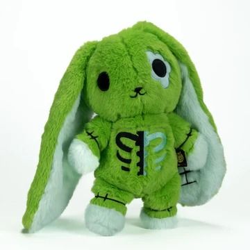 a green stuffed animal rabbit with black eyes and ears, holding the tail of its head