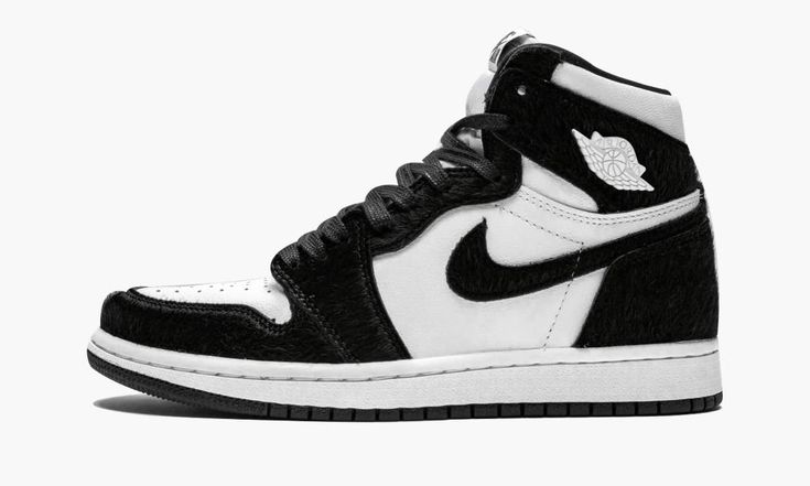 The women’s Air Jordan 1 “Panda” is a special edition of the iconic silhouette designed just for women.  The unique construction of the classic Jordan 1 High features a white leather base with black faux fur panels.  The clean two-tone look is reminiscent of the original black and white Air Jordan 1 colorway from 1985, with the furry construction putting a new twist on the OG look.  The shoe is finished with metal Air Jordan “Wings” logos on each ankle in white.  Each pair also comes with black Air Jordan 1 Panda, Jordan 1 Panda, Womens Air Jordan 1, Womens Air Jordan, Wmns Air Jordan 1, Jordan 1 Black, Dr Shoes, Jordan Shoes Girls, Nike Air Shoes