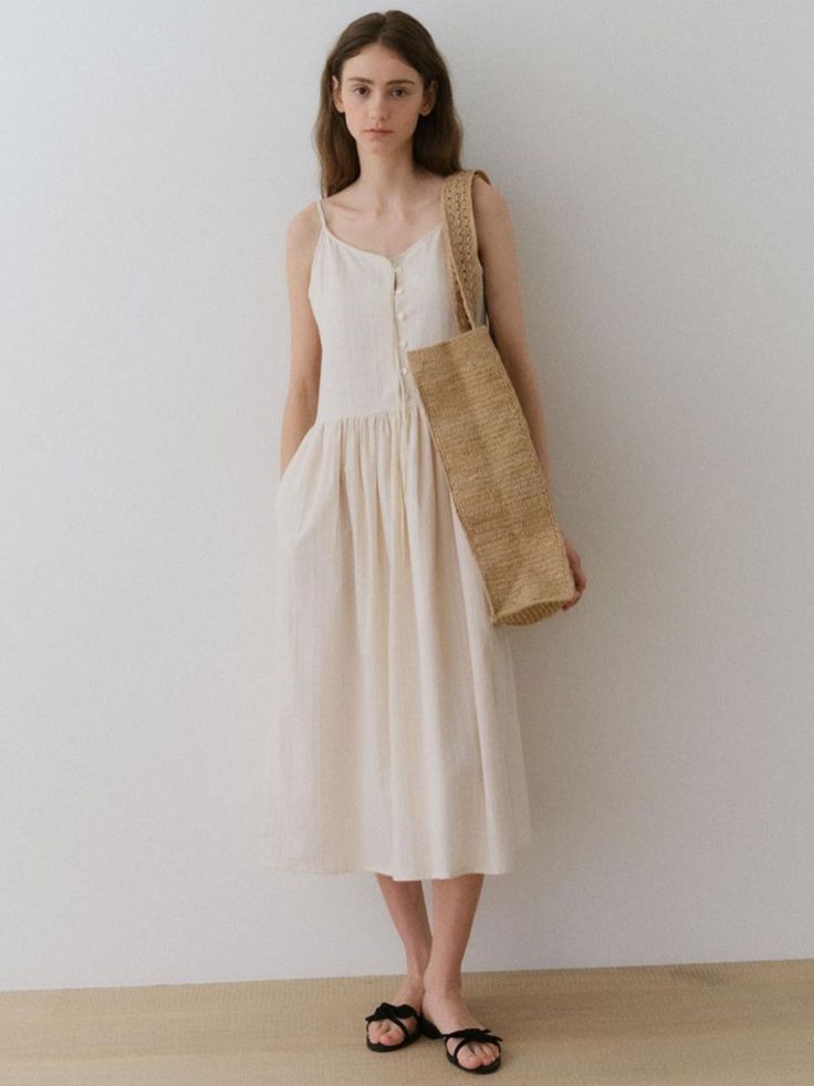 This is a trendy and feminine dress by LOVE US U that is made out of high quality and sturdy material. With distinctive mood of the design and comfortable wear, you can style it for your casual daily outfit.- Logo engraved sea shell buttons- High quality ribbon tape detail- Casual and feminine mood Feminine Beige Cotton Maxi Dress, Beige Cotton Sundress, Feminine Cream Cotton Midi Dress, Chic Beige Knee-length Sundress, Beige Cotton Summer Sundress, Beige Cotton Sundress For Summer, Summer Beige Cotton Sundress, Casual Cream Midi Dress For Spring, Chic Cream Linen Midi Dress