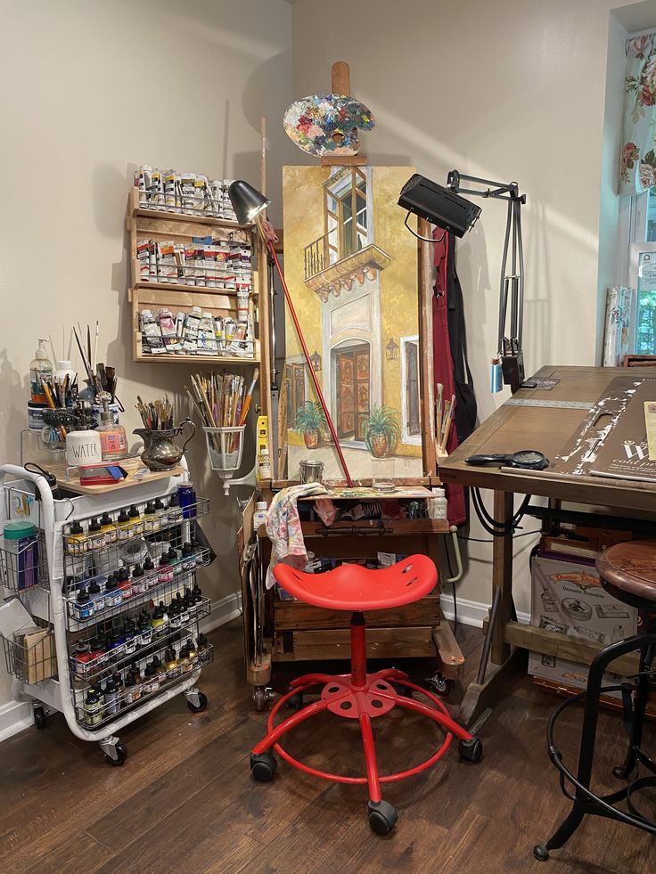 an artist's studio with various art supplies on display