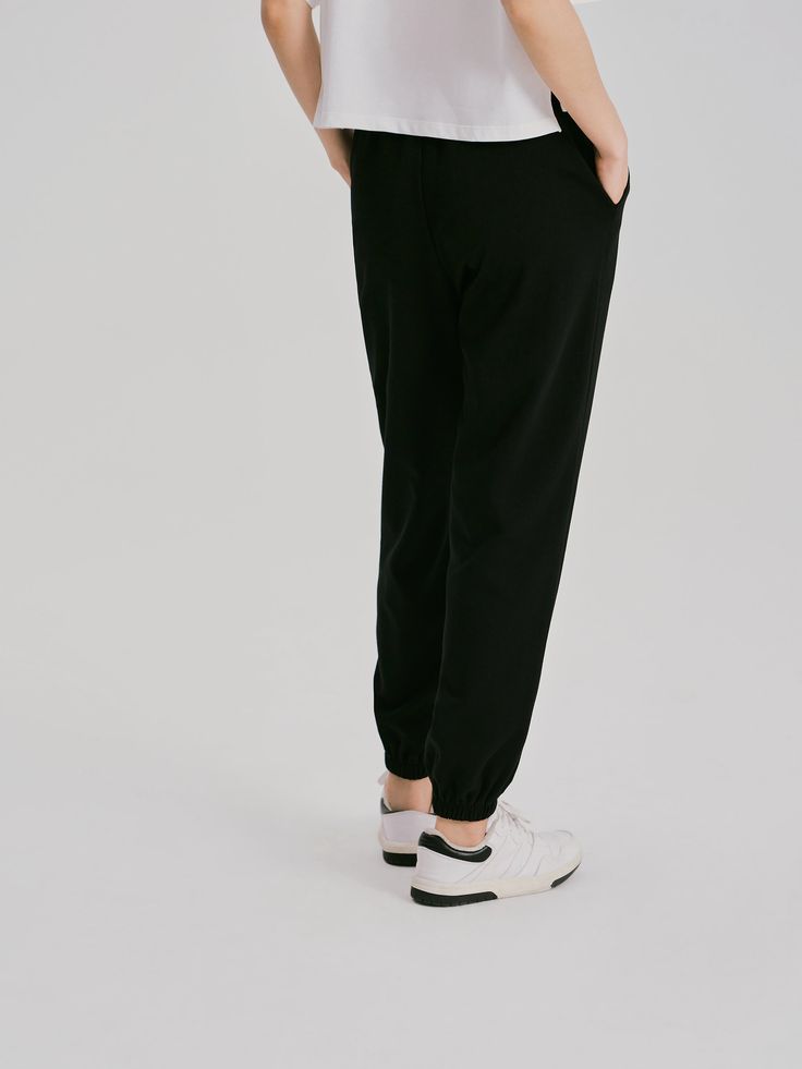 Details: Black color casual pants Made of high-count combed cotton, soft and comfortable to the touch Elastic waist, easy to put on and take off Customized embroidery, drawstring leg Materials & Care: Cotton 80.2%, Polyester 19.8% Hand wash | Dry clean Do not bleach Size & Fit: Model is 5'7", Bust 32, Waist 24, Hips 35, wearing a size S Item #: WM2PA07 Chic Me, Sport Pants, Combed Cotton, Put On, Business Casual, Comb, Black Pants, Casual Pants, Sweat Shirt