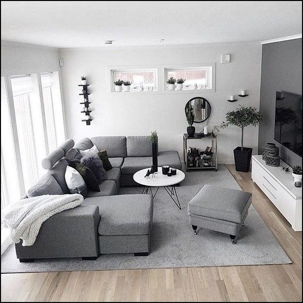 a living room filled with furniture and a flat screen tv