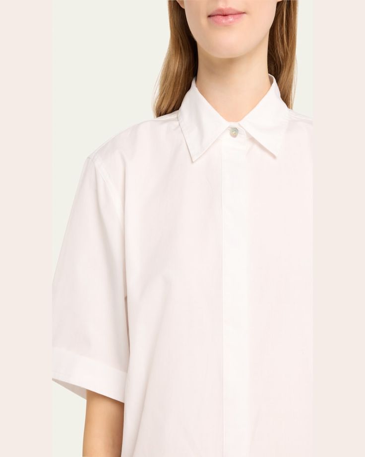 Vince crop shirt punctuated by motherofpearl buttons    Approx. 22.1”L from shoulder to hem    Spread collar; hidden button placket    Short sleeves    Yoked back    Hip length    Boxy fit    Cotton    Imported Elegant Cotton Cropped Shirt For Work, Elegant Collared Cropped Shirt For Spring, Elegant Button-up Cropped Shirt For Spring, Elegant Cropped Button-up Shirt For Spring, Collared Blouse With Hidden Button Closure For Daywear, Oversized Shirt With Concealed Placket, Classic Cropped Shirt, Classic Cropped Shirt For Daywear, Formal Cropped Top With Button Closure