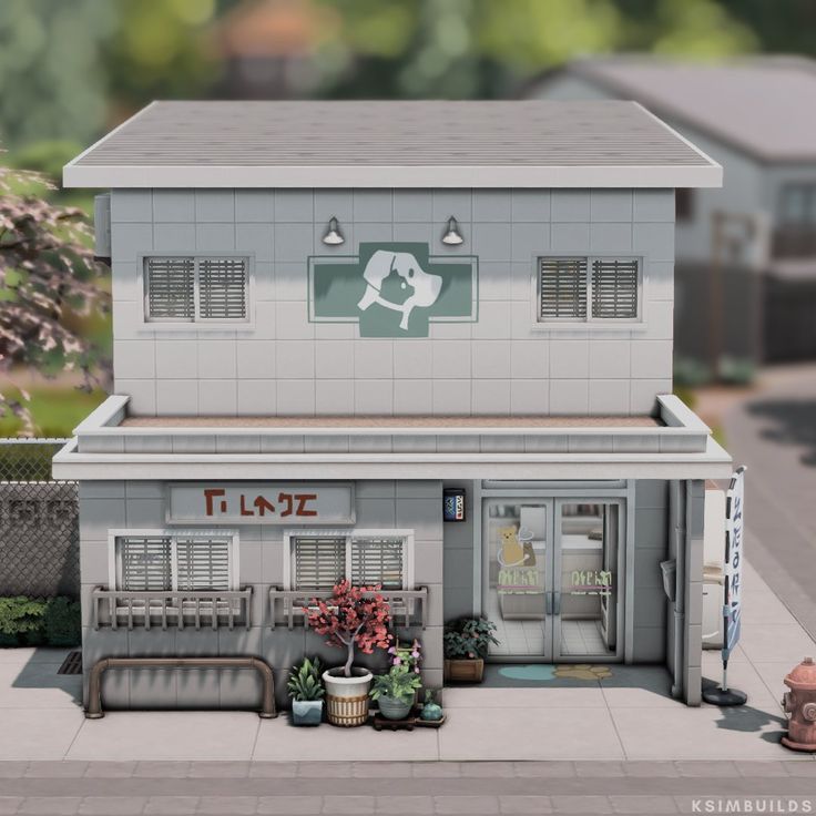 a small model of a store front with potted plants on the outside and windows