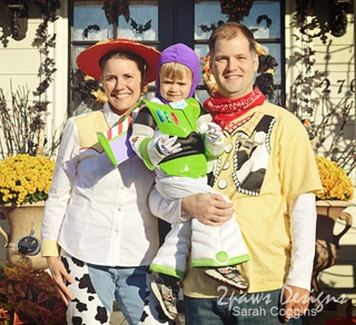 a man, woman and child are dressed up as toy story characters in front of a house