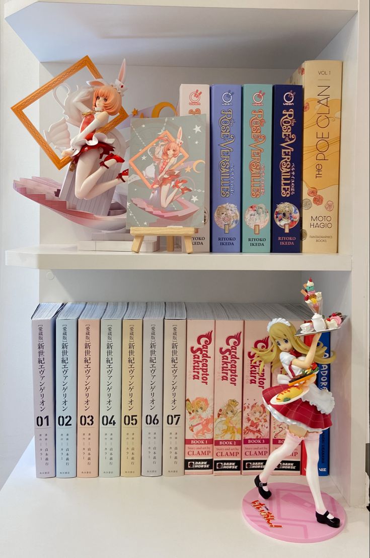 there is a shelf with books and figurines on it, all in different colors