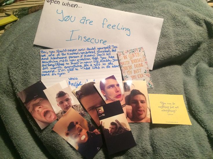 some pictures and post it notes are laying on a blanket with a note attached to them