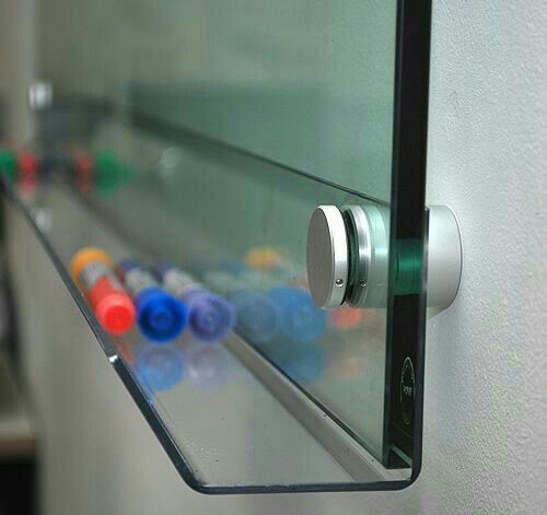 a close up of a glass shelf with buttons on it