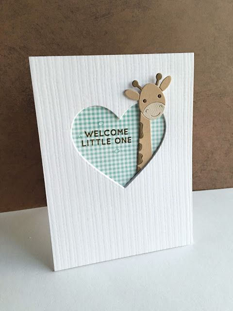 a card with a giraffe in the shape of a heart that says welcome little one