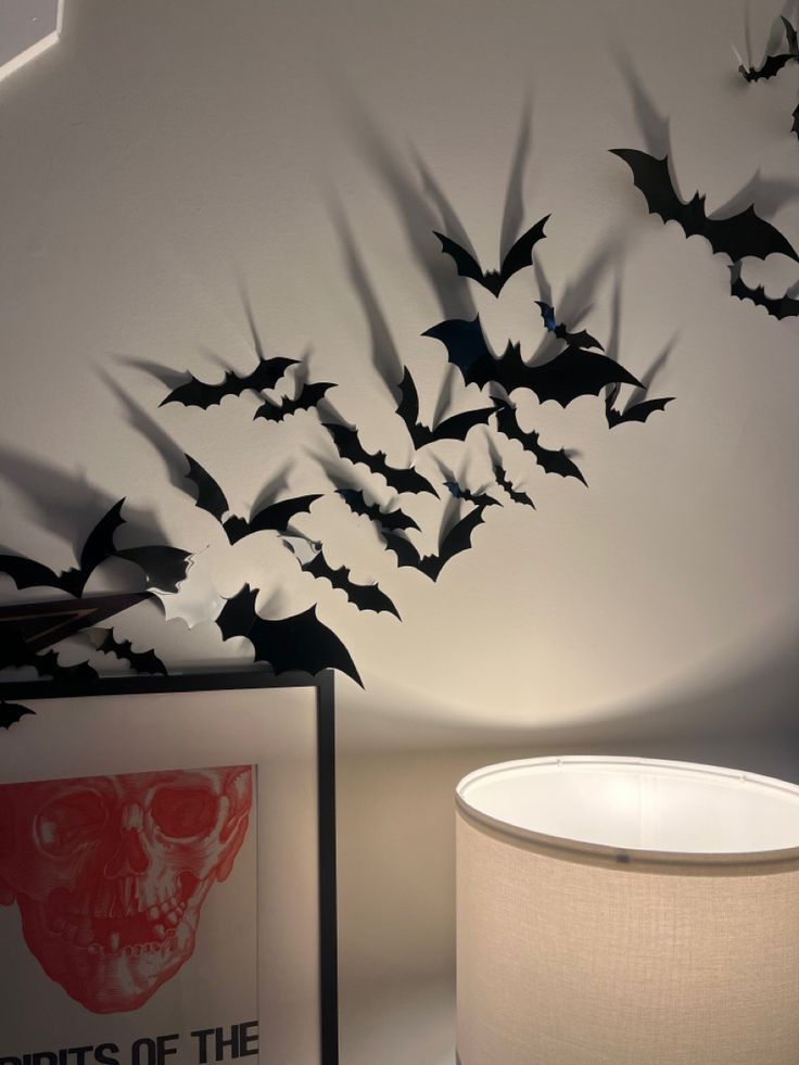 a lamp that is next to a wall with bats on it