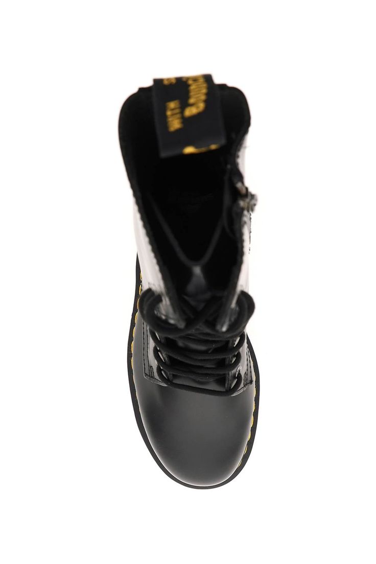 Step into the spotlight with these 'JADON HI' lace-up combat boots from Dr. Martens. Crafted in luxurious polished smooth leather, these boots exude confidence and style. The front lace-up closure with ten metal eyelets and side zip closure add a touch of edgy flair, while the iconic contrasting stitching on the base and rear loop tab in branded ribbon showcase the brand's attention to detail. The rubber quad platform sole not only adds a bold statement to your outfit, but also provides comfort Dr Martens Jadon Hi, Jadon Hi, Tv Walls, Dr Martens Jadon, Leather Platform Boots, Design Tv, Lace Up Combat Boots, Boots Uk, Sneaker Wedge