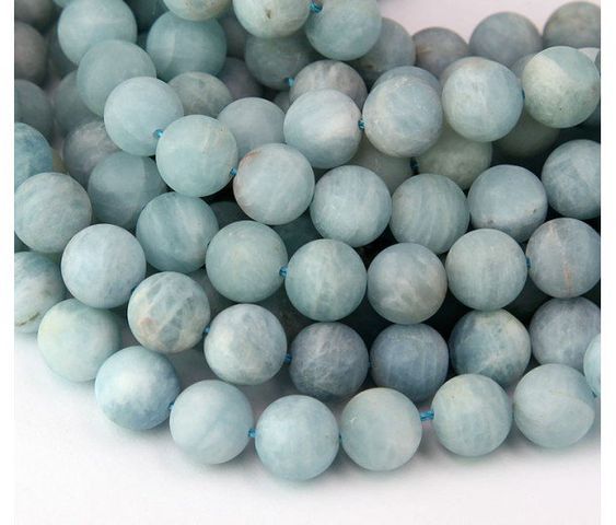 the beads are light blue and have white speckles on them, as if they were marbled