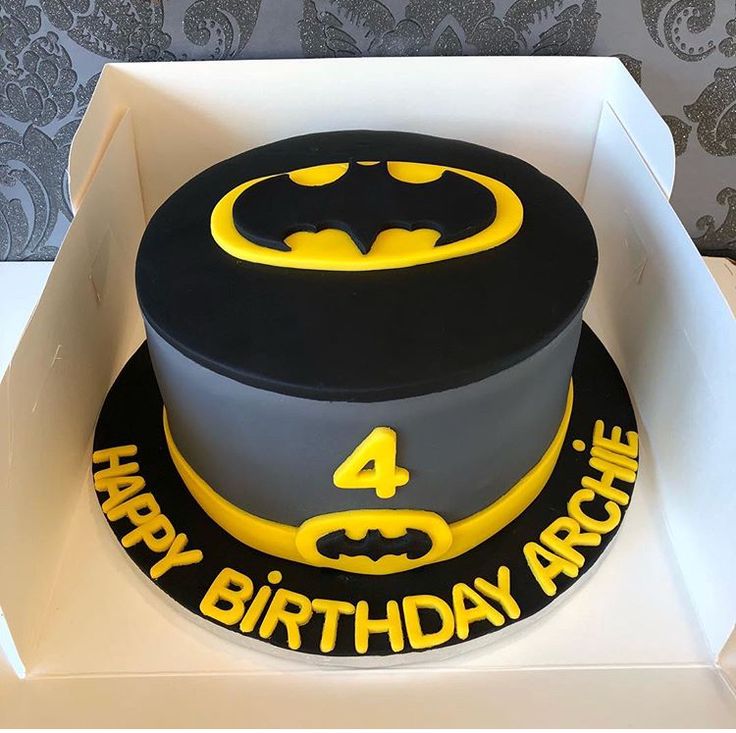 a batman birthday cake in a white box