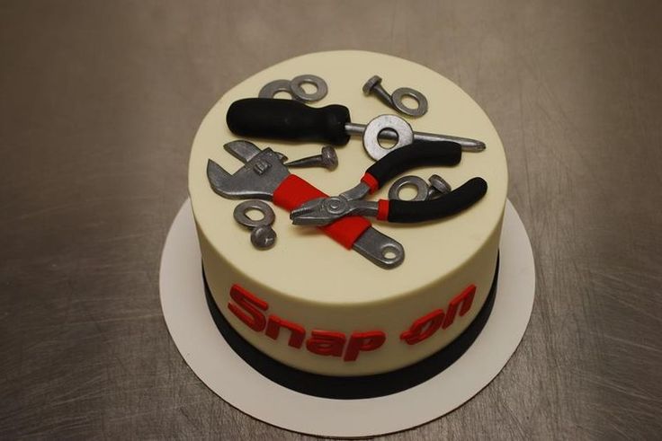 there is a cake that has some tools on it