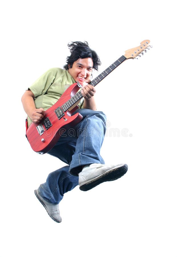 a man jumping in the air while playing an electric guitar royalty images and clippings