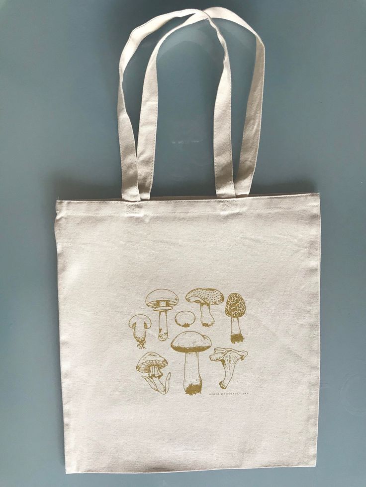 "Introducing my original design - Mushrooms canvas tote bag. Printed by hand with custom mixed colors. * 12.0 oz., 100% heavy canvas * 15\" x 16\" * 20\" self-fabric handles * 10 1/2\" handle drop Thank you for supporting me! © Sydney Sheets, 2021 @thevault.ink : The Vault Design Studio, LLC canvas totes, mushrooms totes, mushroom tote bags, mushrooms, mushroom tote bags, mushroom bags, mushroom canvas totes, mushroom canvas bags, mushroom canvas totes, mushrooms" White Screen Print Canvas Tote Bag, White Canvas Bag With Screen Print, White Screen Printed Canvas Bag, Artistic White Cotton Canvas Bag, Handmade Artistic Cotton Canvas Bag, Artistic Handmade Cotton Canvas Bag, Canvas Bag Painting, Vault Design, Painting Mushrooms