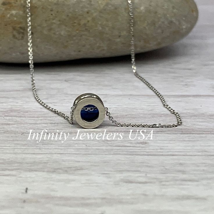 "The pendant pictured is lab created blue sapphire #5871 -Approximate total carat weight: approx. .80ctw diamond equivalent -Center Stone Size: 6mm - approx. .80ct diamond equivalent -Center Stone Shape: round -Gem Type: lab created sapphire -Stone Clarity: VS2 -Stone Color: Blue -Moh's Scale: 9 hardness -Metal Type and Purity: 14k white gold -Setting: bezel set floating necklace -Chain: 18\" delicate 14k gold chain / heavier option with lobster claw available (use dropdown to select) -Country o White Gold Necklace With Birthstone And Lab-created Sapphire, Sapphire Birthstone Necklace With Round Pendant, White Gold Necklace With Lab-created Sapphire Birthstone, Yellow Gold Lab-created Sapphire Jewelry Gift, Sapphire Round Pendant Jewelry, Blue Diamond Jewelry Stamped 14k, White Gold Sapphire Jewelry With Birthstone, White Gold Sapphire Birthstone Necklace, Anniversary Pendant Jewelry With Lab-created Sapphire