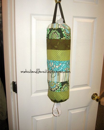 the door is open and there is a green bag hanging from it's handle