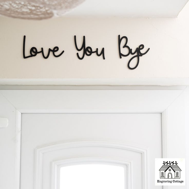 a white door with the words love you be written on it