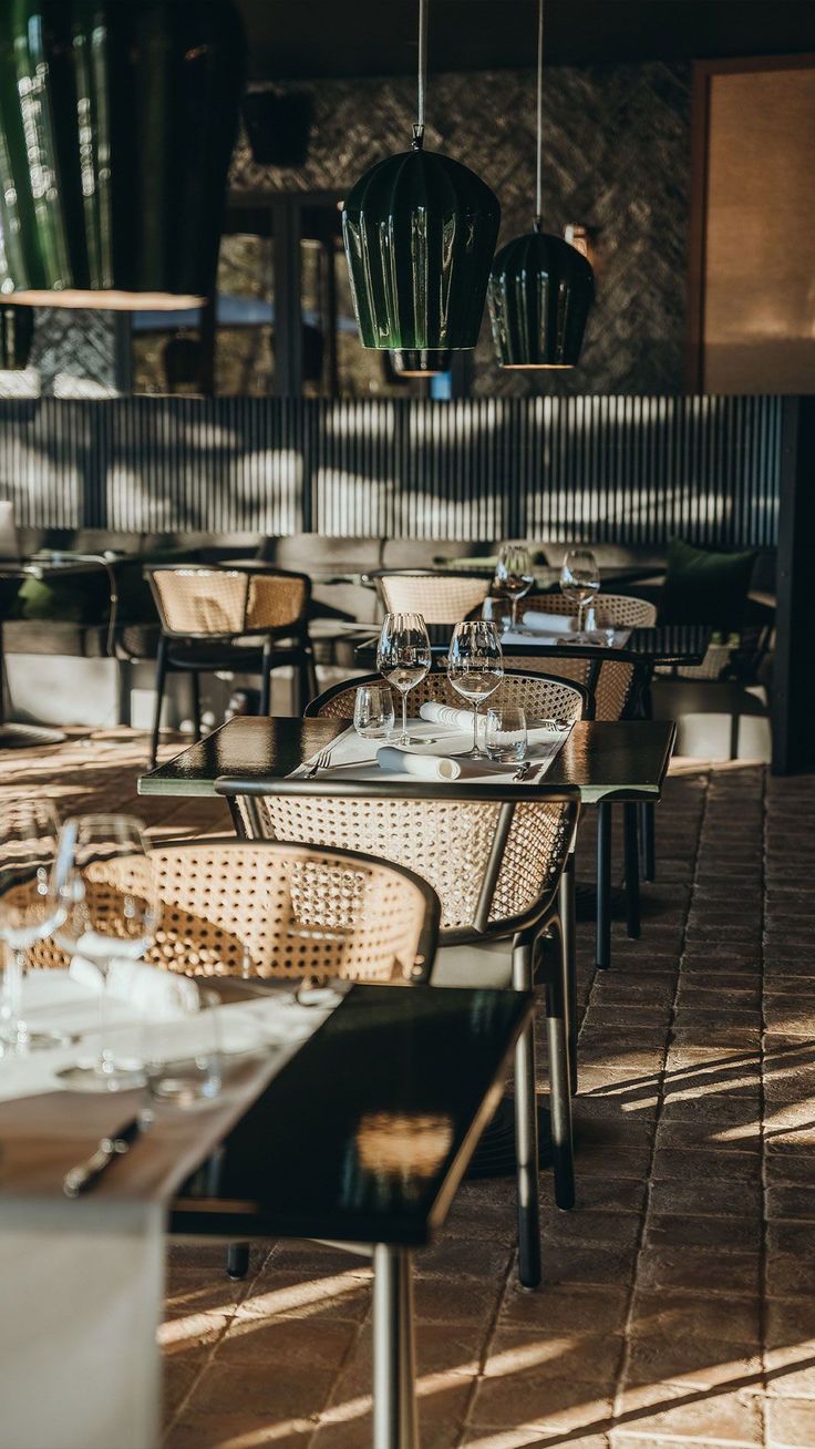 an outdoor dining area with tables and chairs